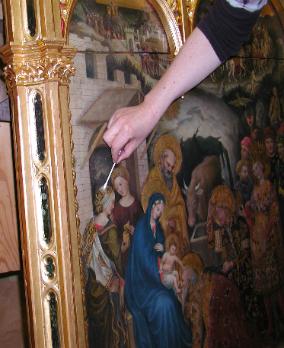 In the Process of Cleaning an Egg Tempera Panel in a Gilded Frame